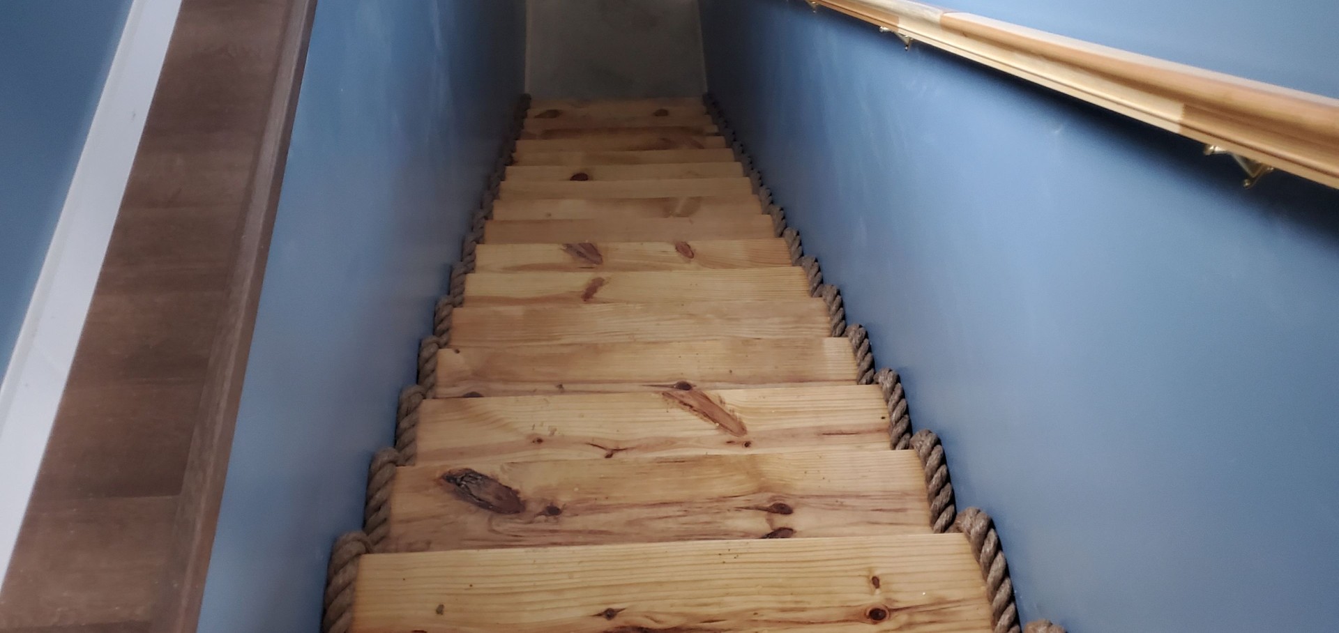 Custom pine staircase with rope trim detail
