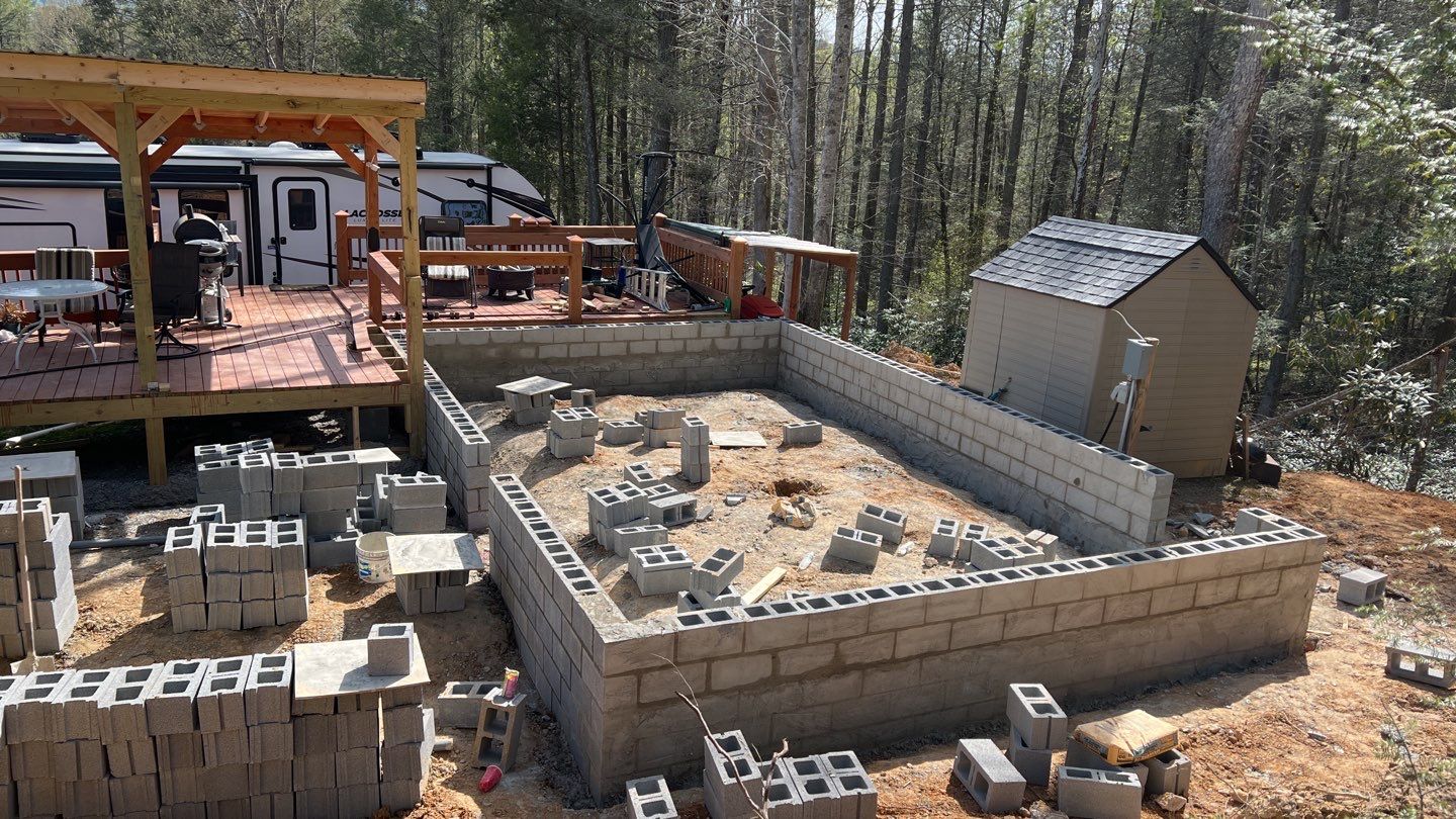 Block foundation construction in wooded setting