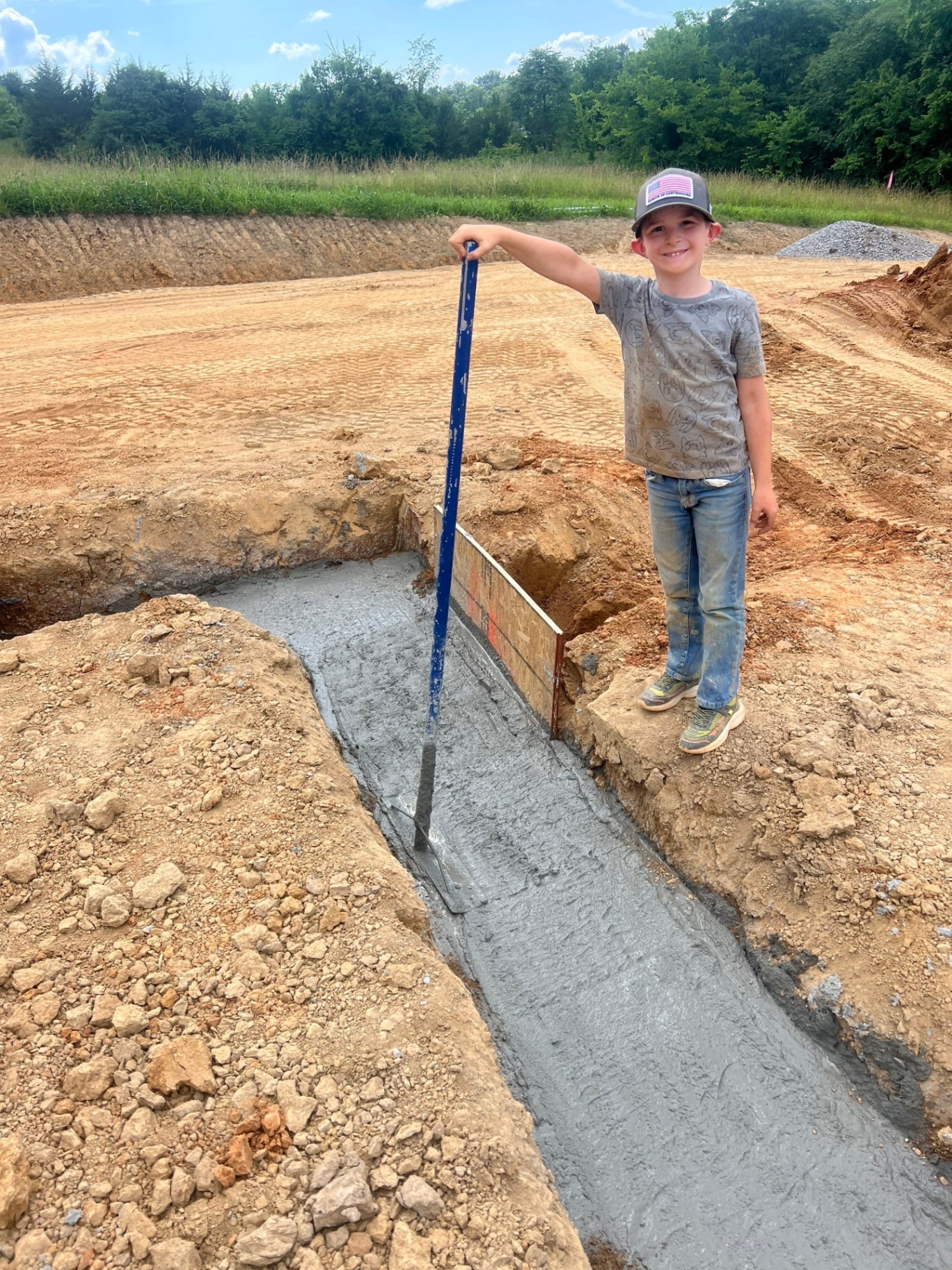 Foundation footing pour with young helper