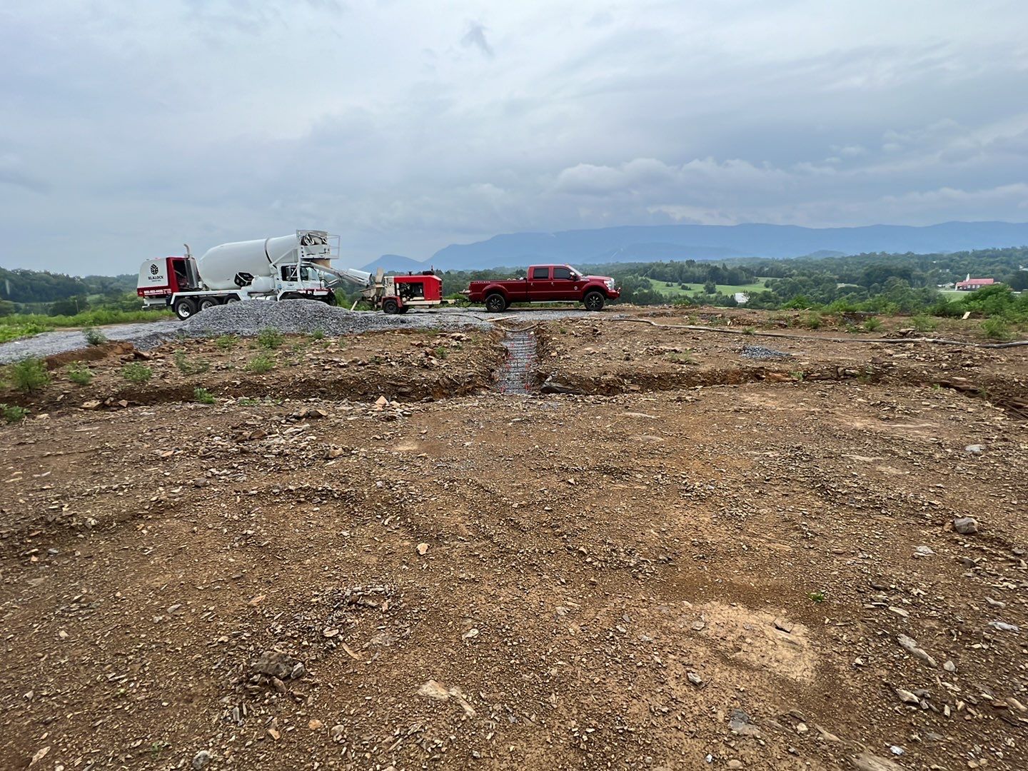 Site work with concrete truck and equipment