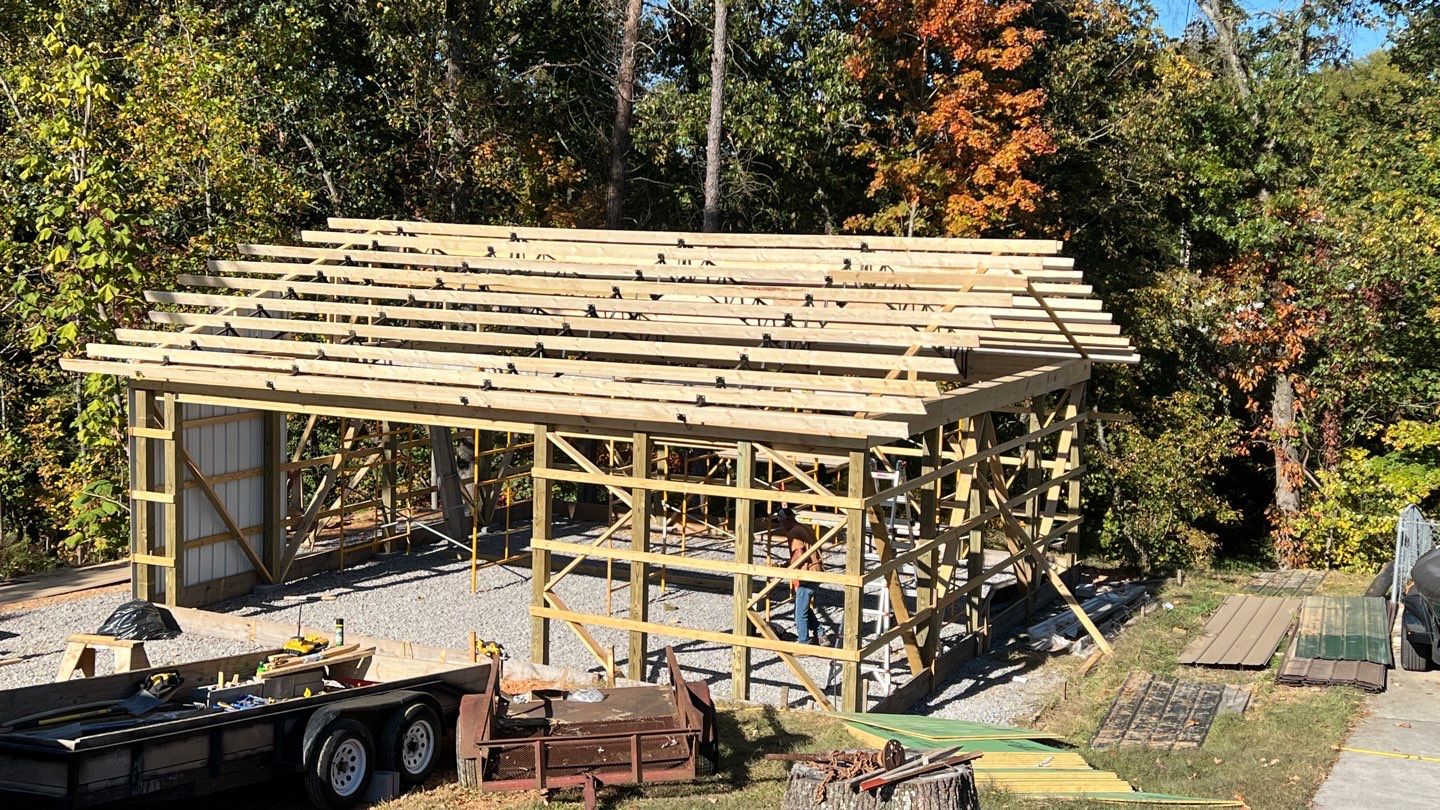Roof truss installation on pole barn addition