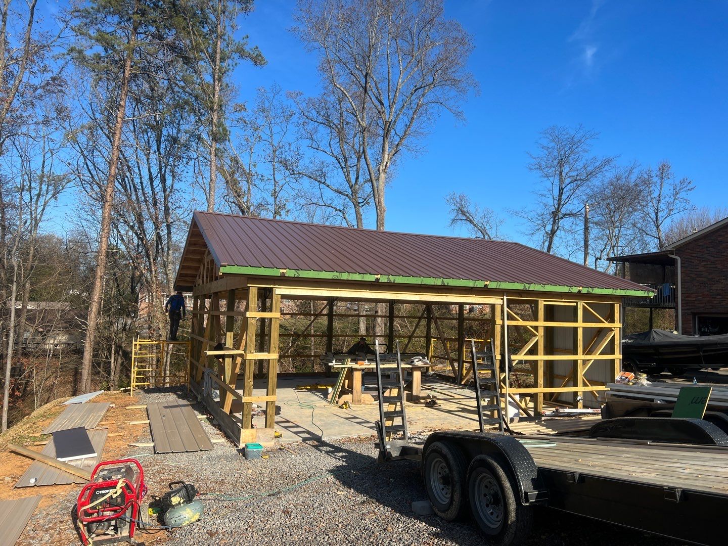 Pole barn construction with metal roofing and framing