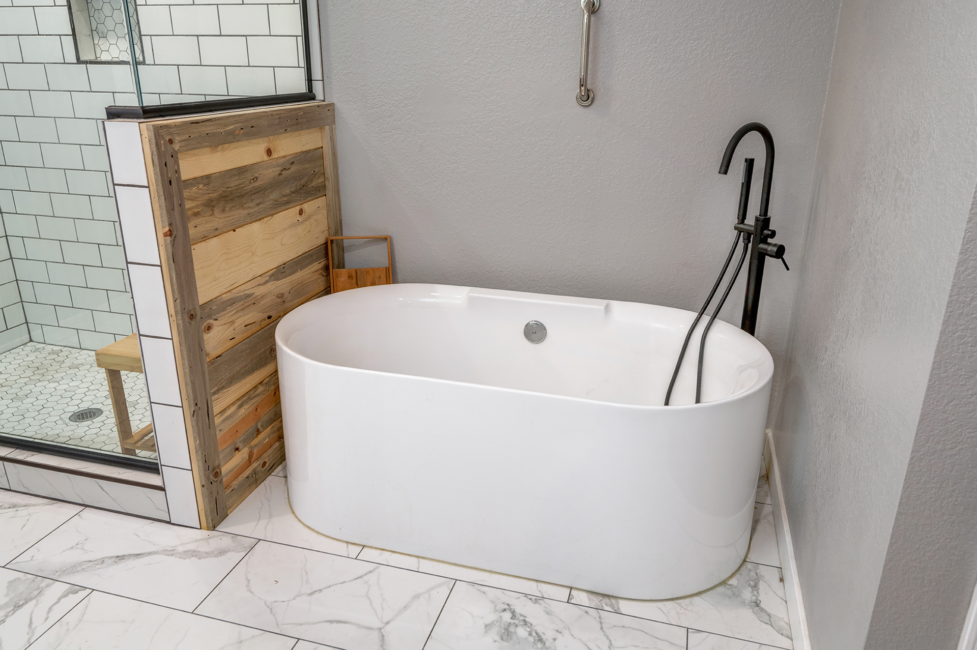 Turner Hill spa bathroom with freestanding tub and wood accent wall